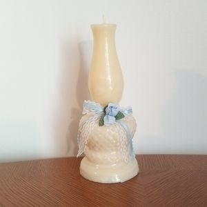 Hurricane shaped candle still in plastic